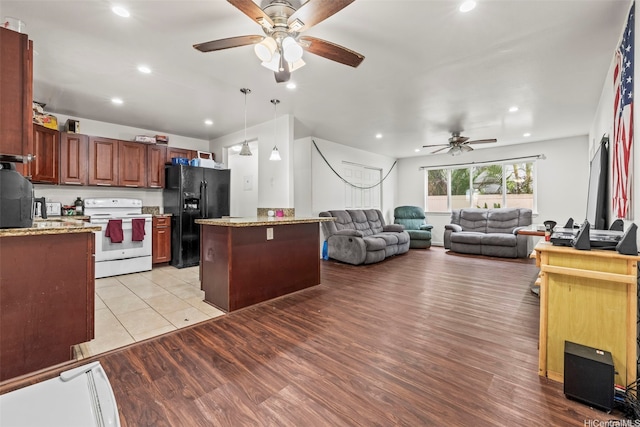 54-220 Kaipapau Loop, Hauula, HI 96717 - kitchen featuring white electric range, black fridge, ceiling fan, recessed lighting, and pendant lighting