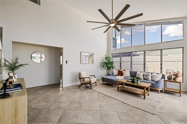 91-506 Pohakupuna Rd, Ewa Beach, HI 96706 - living area featuring a towering ceiling, ceiling fan, light tile patterned floors, and baseboards