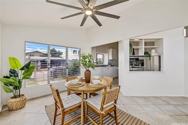 91-506 Pohakupuna Rd, Ewa Beach, HI 96706 - dining space with vaulted ceiling, light tile patterned floors, ceiling fan, and baseboards