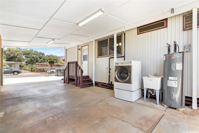 87-217 Maia St, Waianae, HI 96792 - laundry area featuring electric water heater and washer / dryer