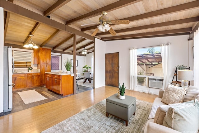 87-217 Maia St, Waianae, HI 96792 - living area featuring wooden ceiling, wood finished floors, ceiling fan, cooling unit, and a chandelier
