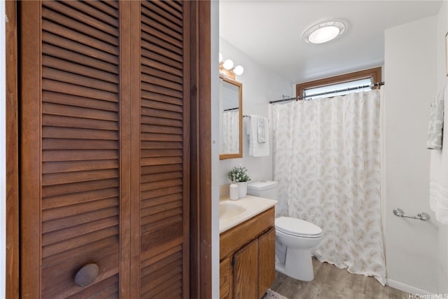 87-217 Maia St, Waianae, HI 96792 - bathroom featuring toilet, vanity, wood finished floors, and a shower with shower curtain