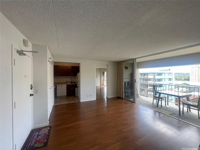 430 Keoniana St Unit 811, Honolulu, HI 96815 - unfurnished living room featuring a textured ceiling and wood finished floors