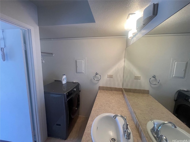 430 Keoniana St Unit 811, Honolulu, HI 96815 - bathroom with washer / dryer, double vanity, and a textured ceiling