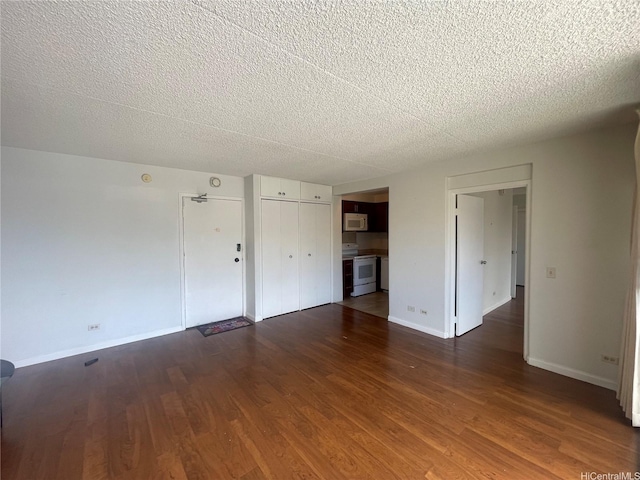 430 Keoniana St Unit 811, Honolulu, HI 96815 - empty room featuring a textured ceiling and dark wood-type flooring