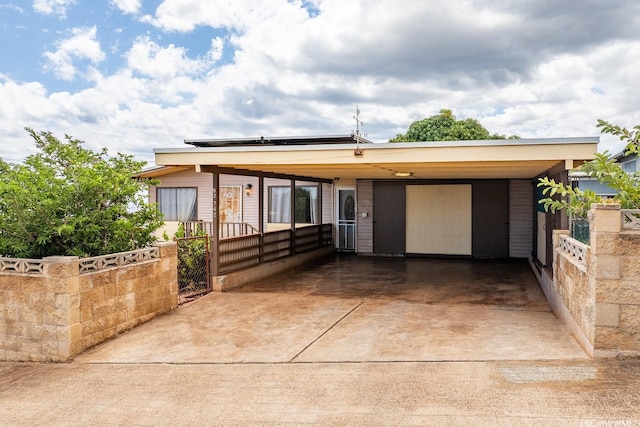 92-742 Nohopono St, Kapolei, HI 96707 - mid-century home with driveway, solar panels, and a gate