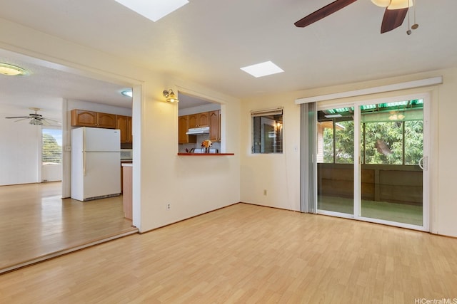 92-742 Nohopono St, Kapolei, HI 96707 - empty room with plenty of natural light, light wood-style flooring, and ceiling fan