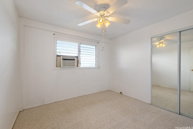 92-742 Nohopono St, Kapolei, HI 96707 - unfurnished bedroom featuring carpet flooring, a closet, a textured ceiling, cooling unit, and ceiling fan