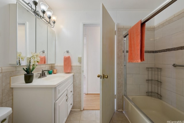 92-742 Nohopono St, Kapolei, HI 96707 - full bathroom featuring vanity, tile patterned flooring, tile walls, shower / bath combination, and toilet
