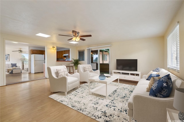 92-742 Nohopono St, Kapolei, HI 96707 - living area with ceiling fan, light wood-style flooring, and plenty of natural light