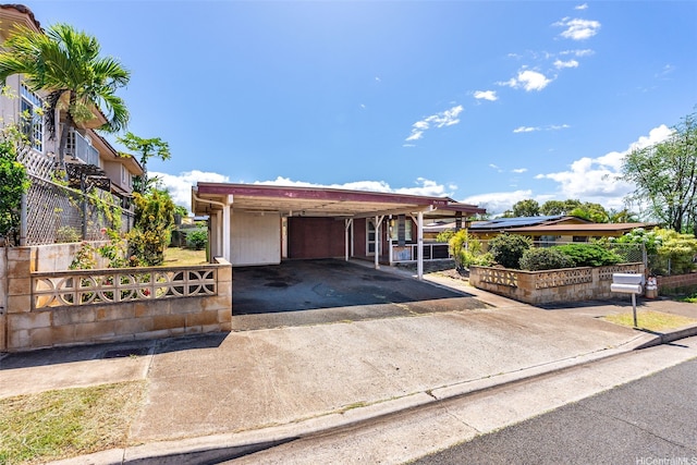94-533 Ulieo St, Waipahu, HI 96797 - view of front of property with driveway and an attached carport