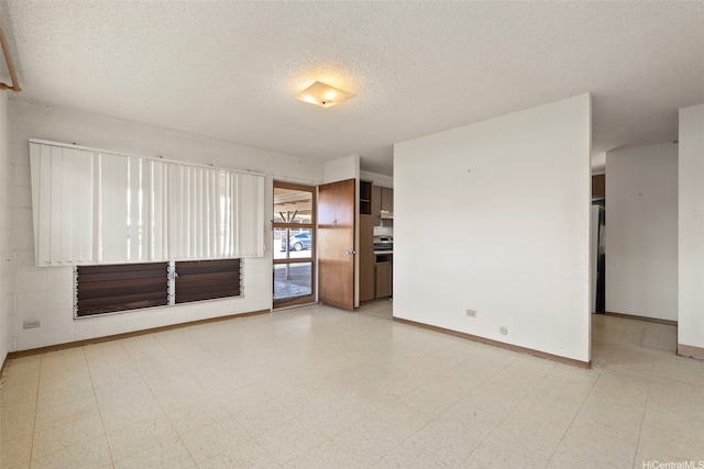 94-533 Ulieo St, Waipahu, HI 96797 - unfurnished living room with a textured ceiling, tile patterned floors, and baseboards
