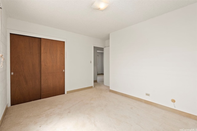 94-533 Ulieo St, Waipahu, HI 96797 - unfurnished bedroom featuring a closet, carpet floors, and baseboards