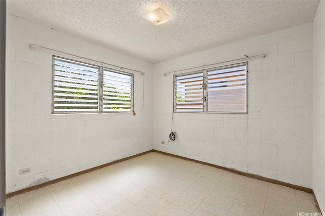 94-533 Ulieo St, Waipahu, HI 96797 - empty room with a textured ceiling, light floors, and baseboards