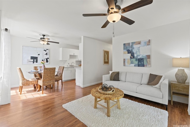 46-1032 Emepela Way Unit 13A, Kaneohe, HI 96744 - living area with a ceiling fan, baseboards, and light wood-type flooring