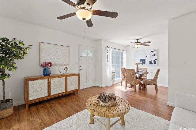 46-1032 Emepela Way Unit 13A, Kaneohe, HI 96744 - living area featuring a ceiling fan, baseboards, and wood finished floors