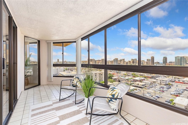 1760 S Beretania St Unit 15B, Honolulu, HI 96826 - sunroom / solarium featuring a skyline view, a textured ceiling, and tile patterned floors
