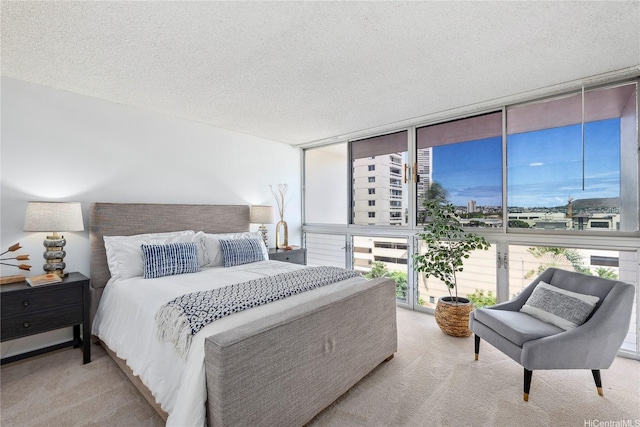 500 University Ave Unit 532, Honolulu, HI 96826 - bedroom featuring floor to ceiling windows, a textured ceiling, and carpet floors