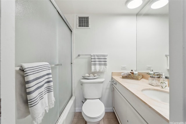 500 University Ave Unit 532, Honolulu, HI 96826 - bathroom featuring vanity, tile patterned floors, toilet, and shower / bath combination with glass door