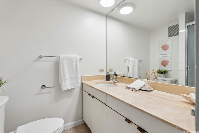 500 University Ave Unit 532, Honolulu, HI 96826 - bathroom featuring toilet, vanity, tile patterned flooring, and a shower with shower door