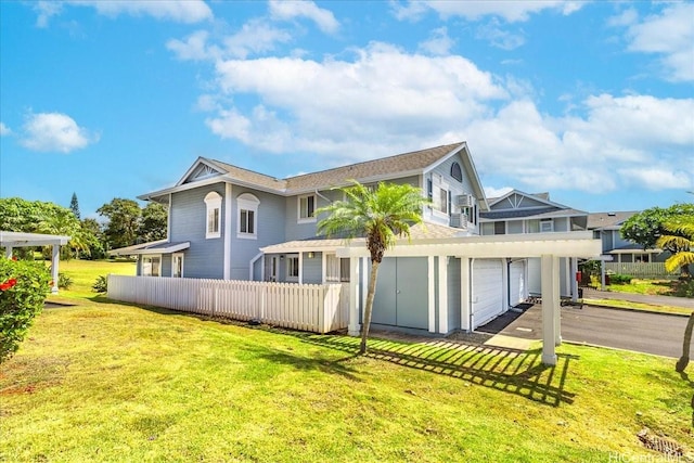 94-816 Lumiauau St Unit Ff101, Waipahu, HI 96797 - rear view of house featuring a garage, asphalt driveway, and roof with shingles
