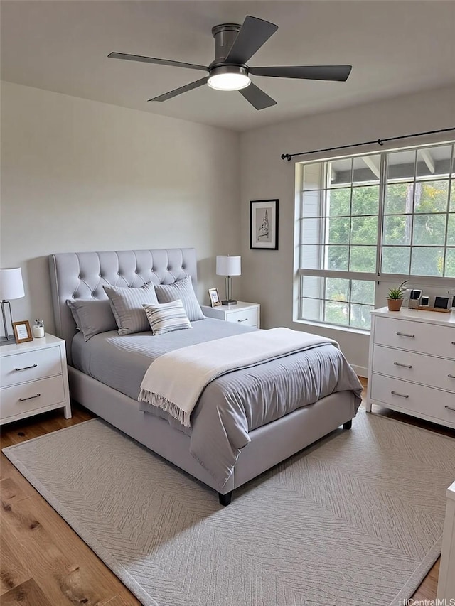 255 Mananai Pl Unit 52T, Honolulu, HI 96818 - bedroom with wood finished floors and ceiling fan