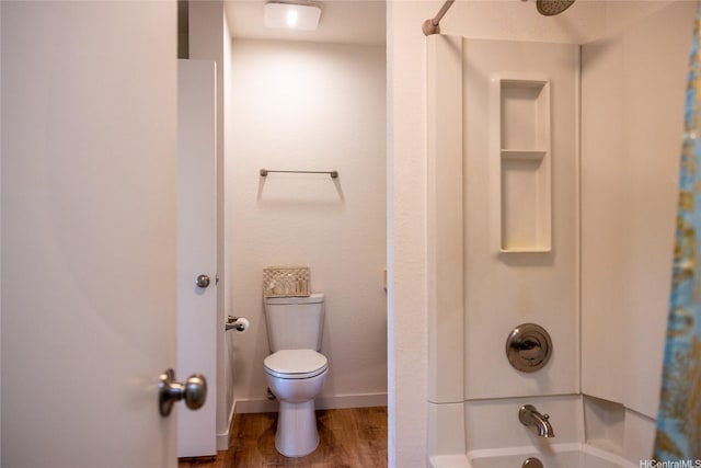 255 Mananai Pl Unit 52T, Honolulu, HI 96818 - full bathroom with wood finished floors, shower / tub combo, toilet, and baseboards