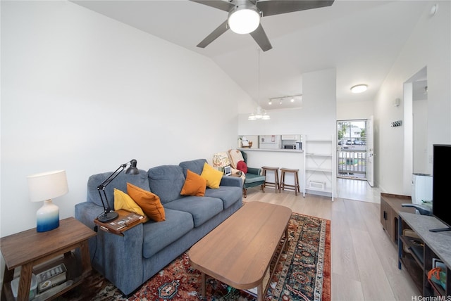 94-510 Lumiaina St Unit L201, Waipahu, HI 96797 - living area with light wood-style flooring, a ceiling fan, lofted ceiling, and a chandelier