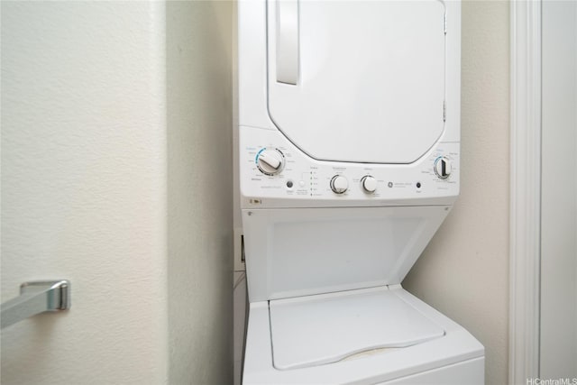 94-510 Lumiaina St Unit L201, Waipahu, HI 96797 - washroom featuring stacked washer / drying machine and a textured wall