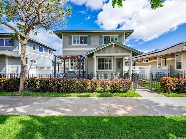 460 Kamaaha Ave Unit 9, Kapolei, HI 96707 - view of front of property featuring a ceiling fan, a gate, a fenced front yard, board and batten siding, and a porch