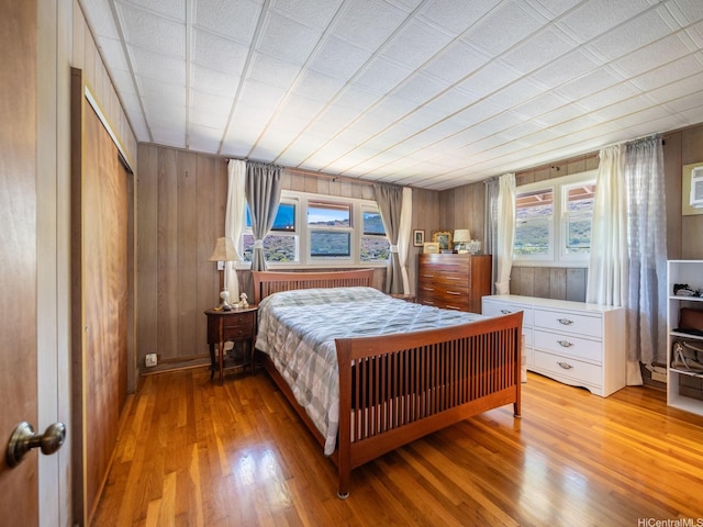 509 Lawelawe St, Honolulu, HI 96821 - bedroom with light wood-style flooring and wooden walls