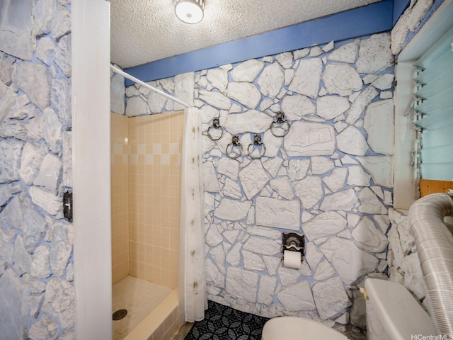 509 Lawelawe St, Honolulu, HI 96821 - full bath featuring a stall shower, toilet, a textured ceiling, and tile patterned floors