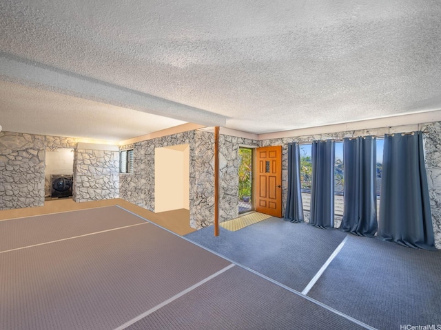 509 Lawelawe St, Honolulu, HI 96821 - unfurnished living room with a textured ceiling and carpet floors
