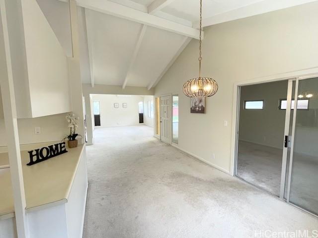 436 Kekauluohi St, Honolulu, HI 96825 - unfurnished dining area with light colored carpet, high vaulted ceiling, beamed ceiling, and a chandelier