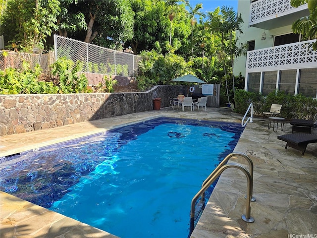 3061 Pualei Cir Unit 105, Honolulu, HI 96815 - view of swimming pool with a fenced backyard and a patio