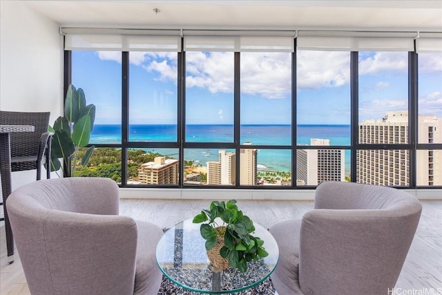 229 Paoakalani Ave Unit Ph-3807, Honolulu, HI 96815 - living room with healthy amount of natural light, a water view, and expansive windows