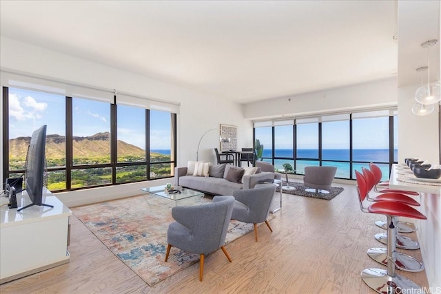 229 Paoakalani Ave Unit Ph-3807, Honolulu, HI 96815 - living room with wood finished floors and a water view