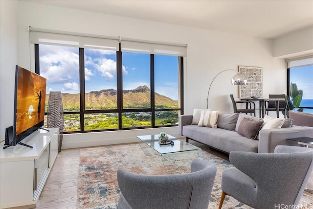 229 Paoakalani Ave Unit Ph-3807, Honolulu, HI 96815 - living area featuring light wood finished floors and a mountain view