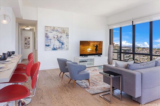 229 Paoakalani Ave Unit Ph-3807, Honolulu, HI 96815 - living area with wood finished floors and baseboards