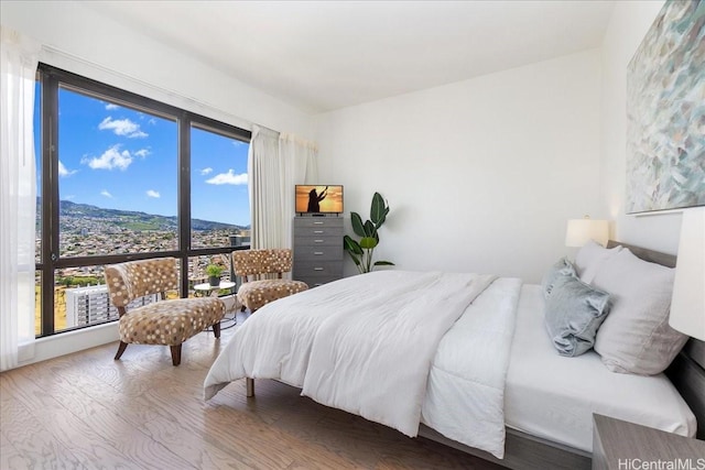 229 Paoakalani Ave Unit Ph-3807, Honolulu, HI 96815 - bedroom with wood finished floors