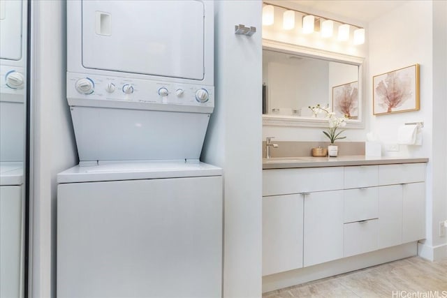 229 Paoakalani Ave Unit Ph-3807, Honolulu, HI 96815 - laundry room with stacked washer / dryer