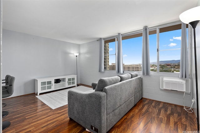 909 Ala Nanala St Unit 1401, Honolulu, HI 96818 - living area with dark wood-style flooring and concrete block wall
