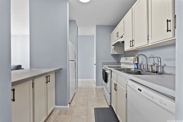 909 Ala Nanala St Unit 1401, Honolulu, HI 96818 - kitchen featuring white appliances, baseboards, under cabinet range hood, light tile patterned floors, and a sink