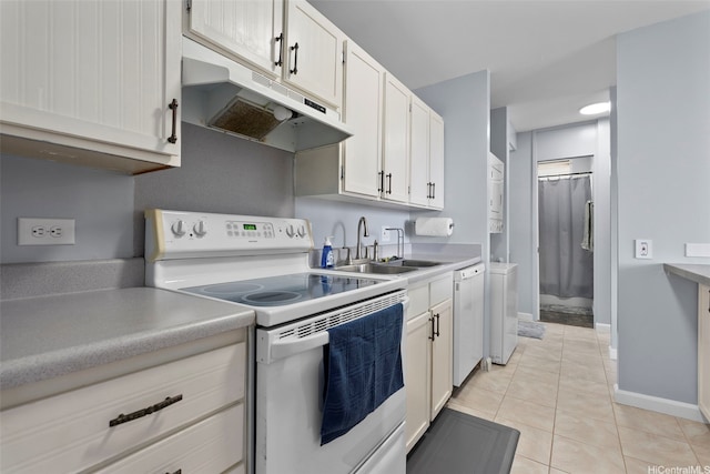 909 Ala Nanala St Unit 1401, Honolulu, HI 96818 - kitchen featuring white appliances, under cabinet range hood, a sink, light countertops, and light tile patterned floors