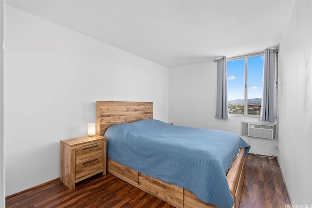 909 Ala Nanala St Unit 1401, Honolulu, HI 96818 - bedroom featuring dark wood-style flooring and a wall mounted air conditioner