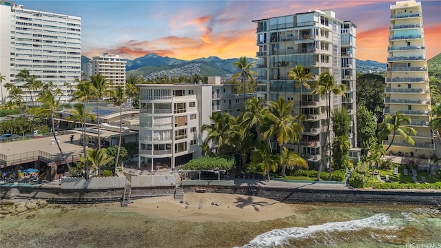 2943 Kalakaua Ave Unit 606, Honolulu, HI 96815 - property at dusk with a mountain view and a view of apartment building / complex