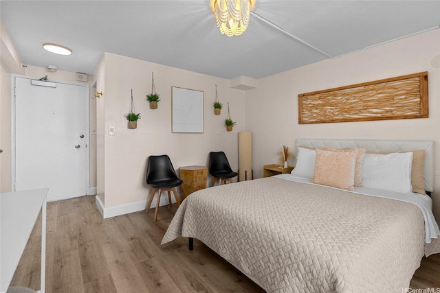 2450 Prince Edward St Unit 1006A, Honolulu, HI 96815 - bedroom with wood finished floors and baseboards
