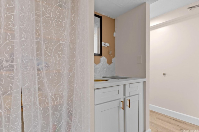 2450 Prince Edward St Unit 1006A, Honolulu, HI 96815 - full bathroom with wood finished floors, vanity, and baseboards