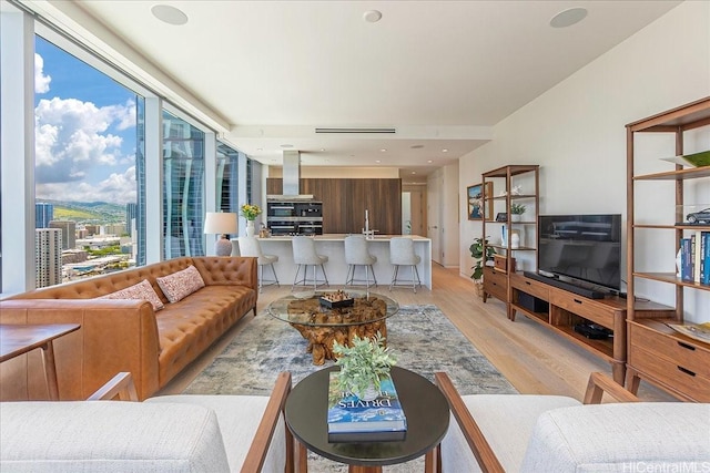 1118 Ala Moana Blvd Unit 2505, Honolulu, HI 96814 - living area featuring light wood-style floors