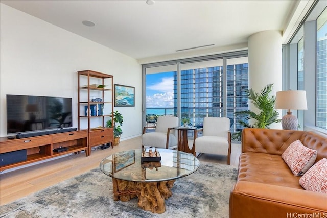 1118 Ala Moana Blvd Unit 2505, Honolulu, HI 96814 - living room featuring wood finished floors and expansive windows